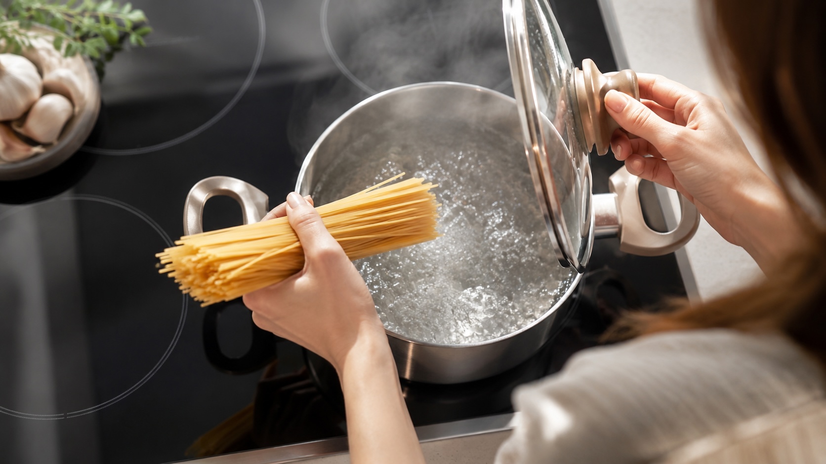 Cooking pasta with pure filtered water in a modern kitchen